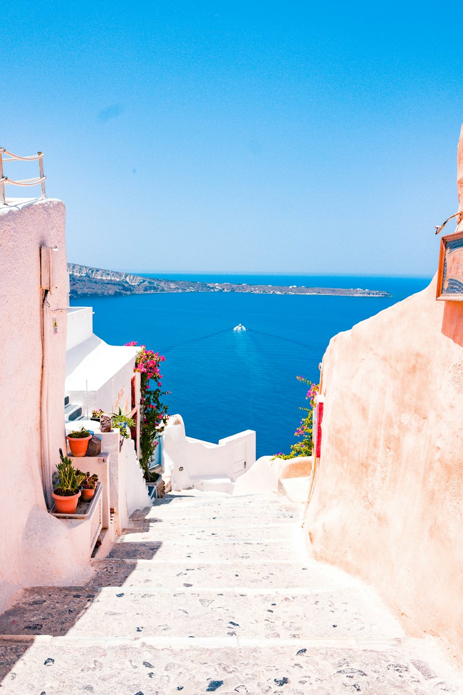 Whitewashed stairway above the blue sea in Santorini, Greece